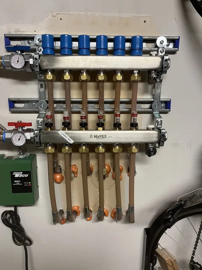 Plumber performing Water Heater Repair at a residential property in Johnston City